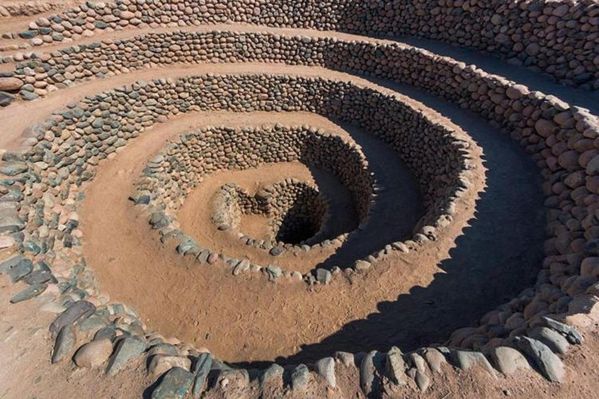 a sand sculpture of a heart in the desert