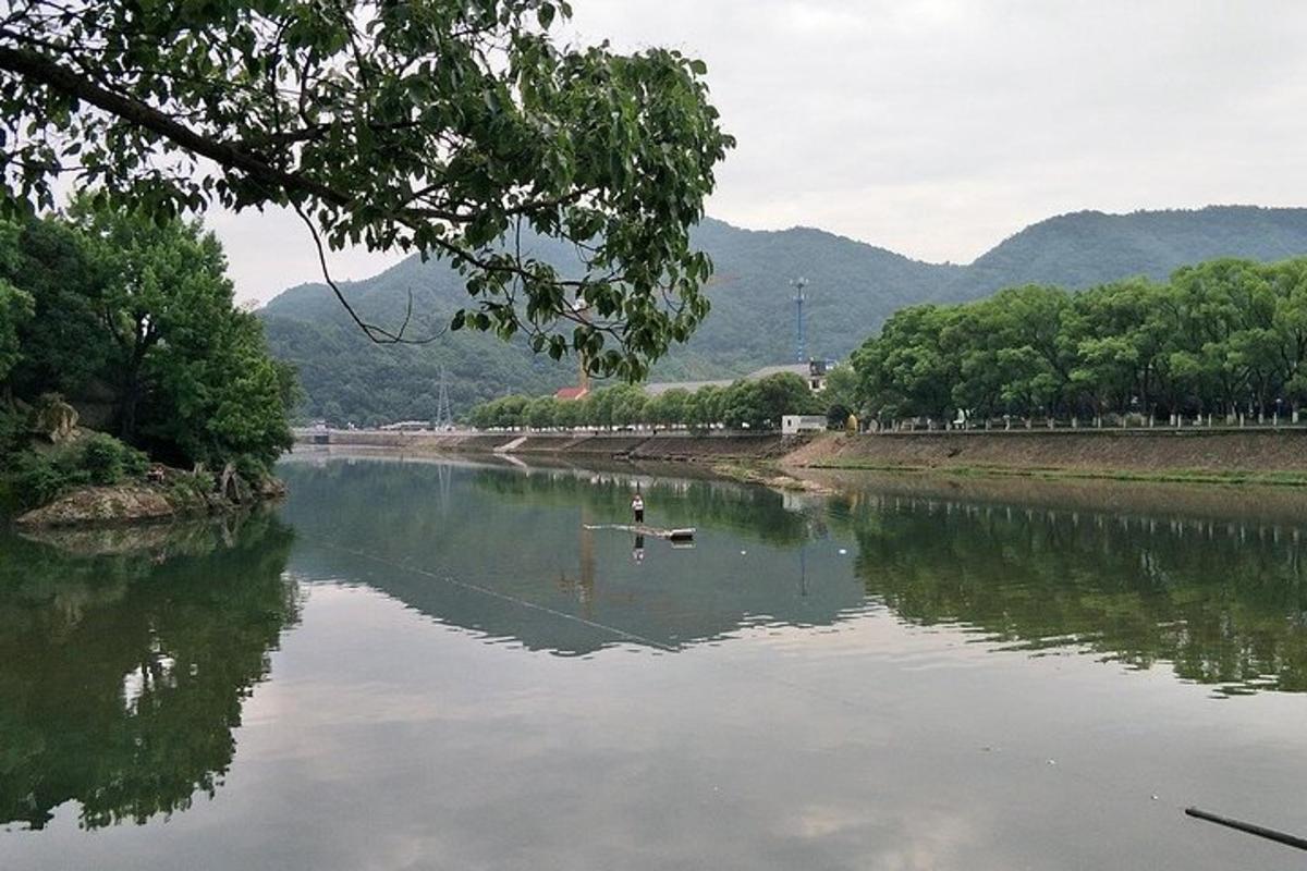 a river with a couple of ducks in the water