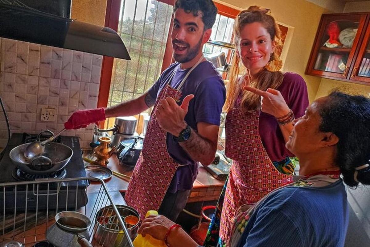 a group of people in a kitchen preparing food