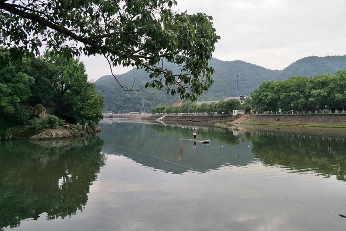 a river with two ducks in the water