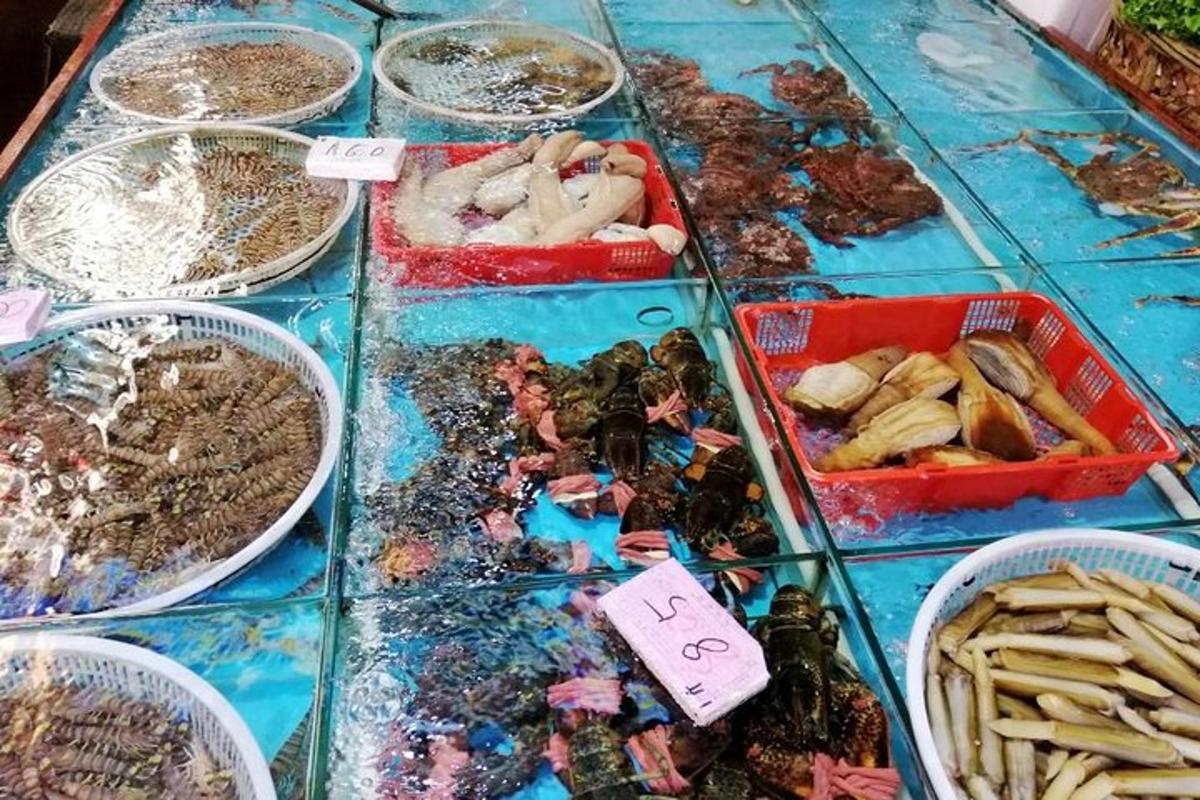 a table topped with trays of different types of food