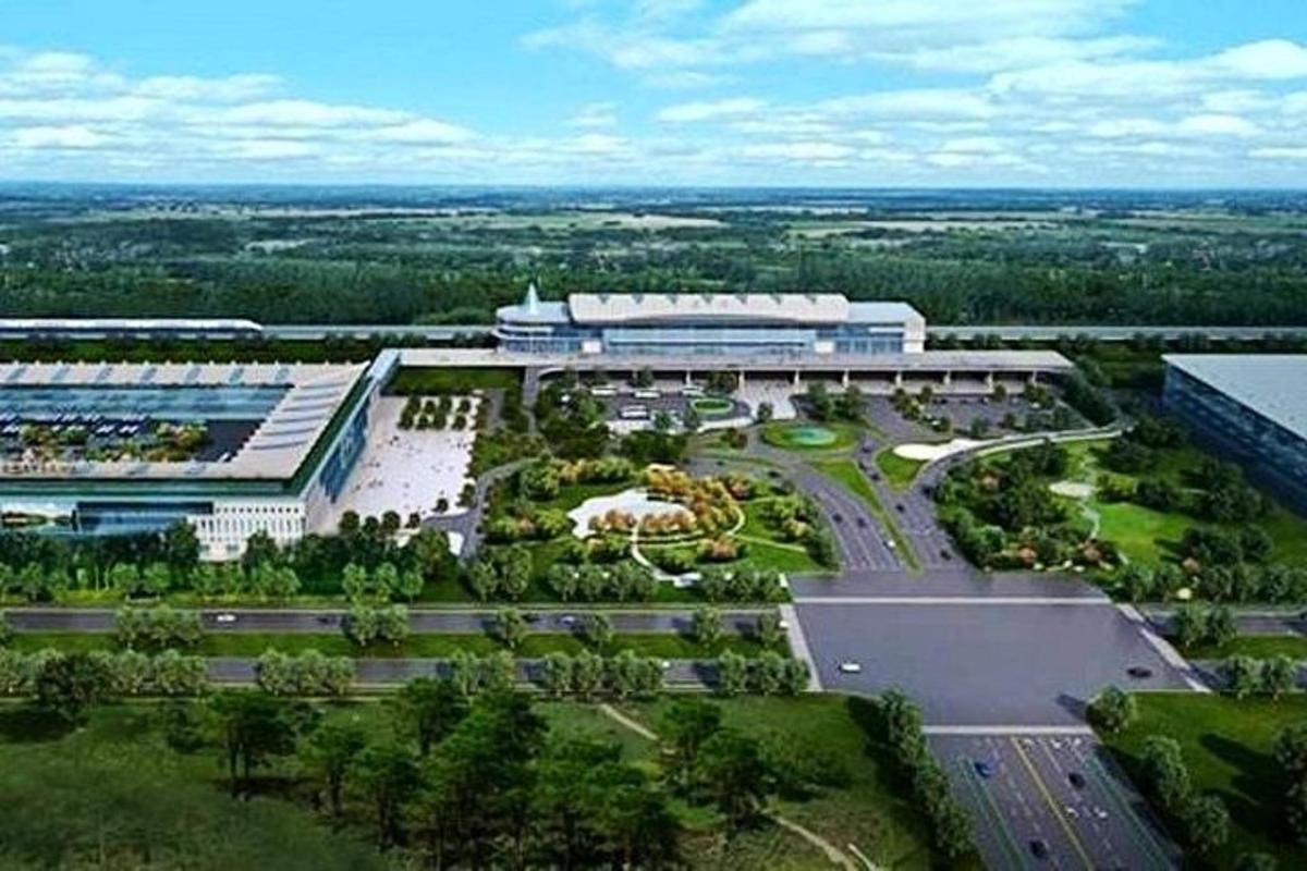 an aerial view of a building with a lot of trees