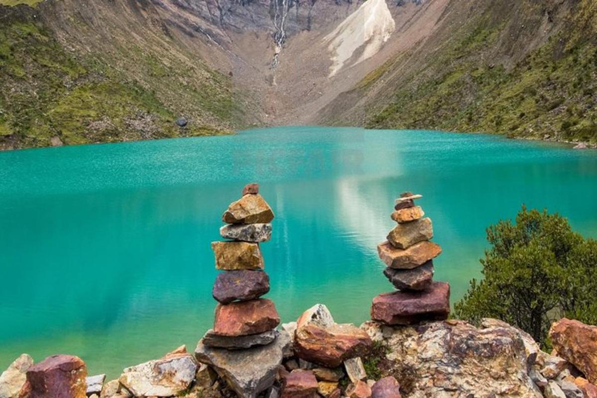 a stack of rocks sitting on top of a lake