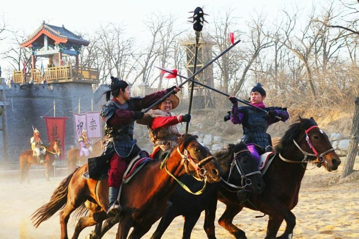 three people on horseback playing a game of polo
