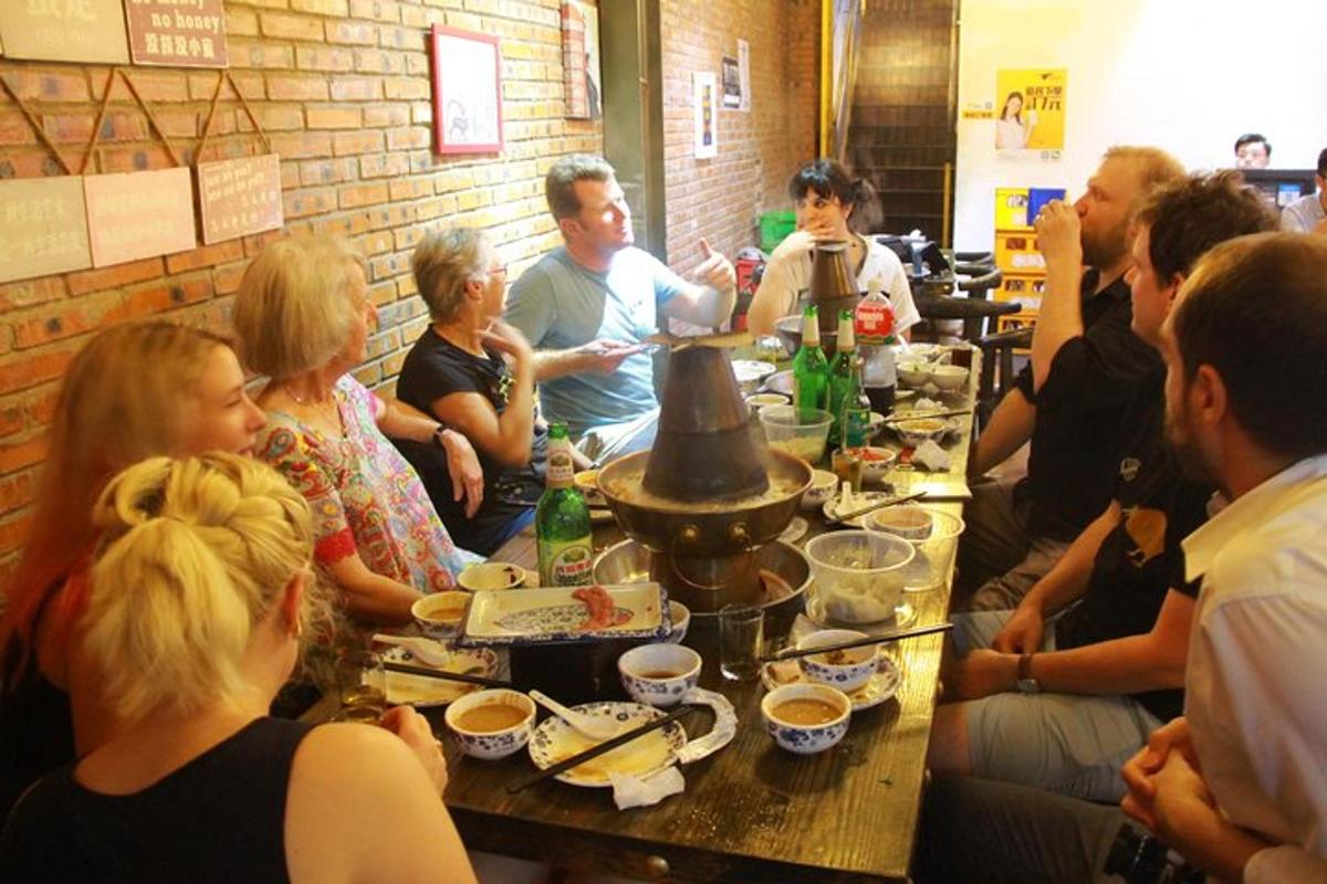 a group of people sitting around a table eating food