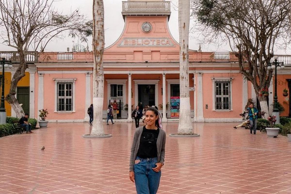 a woman standing in front of a building