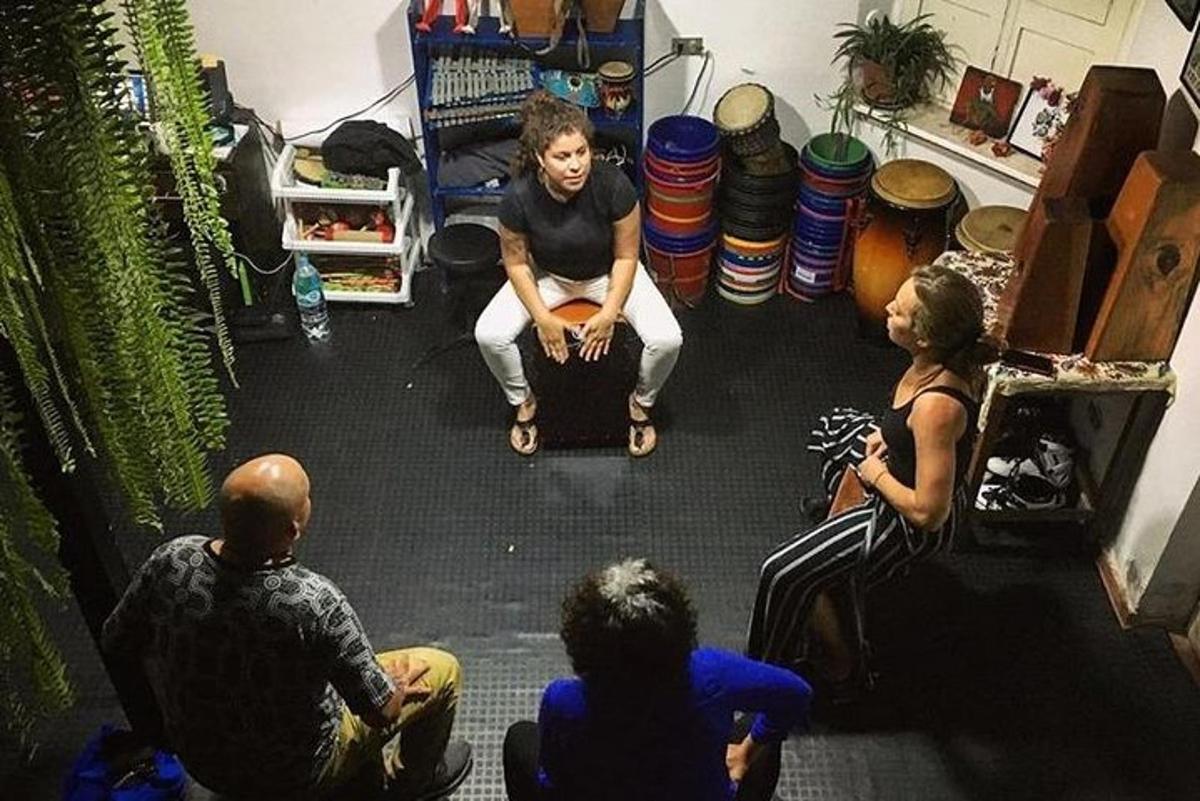 a group of people sitting on the floor in a room