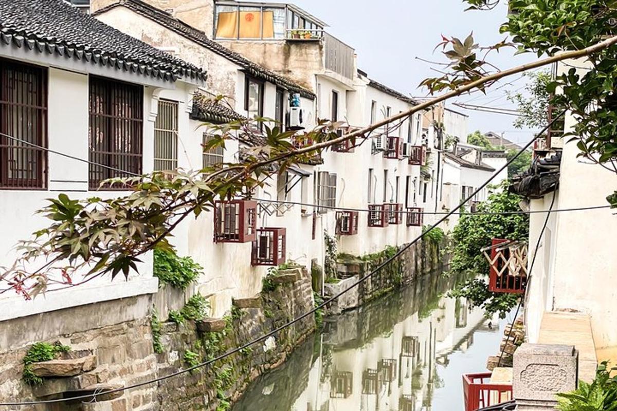 an alley in an old town with a canal