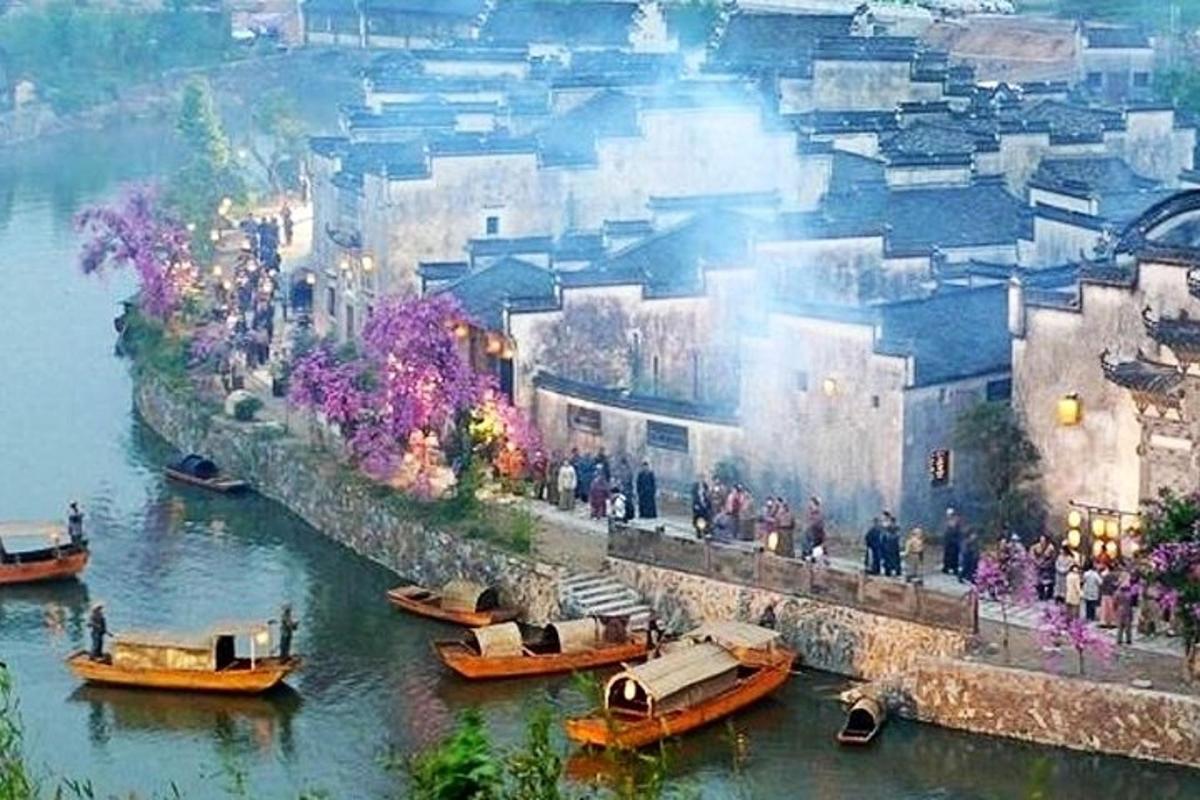 a group of boats on a river with a group of people