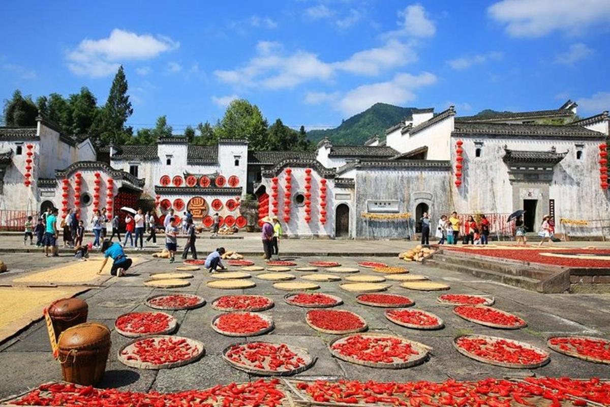 a group of red and white pizzas on the street