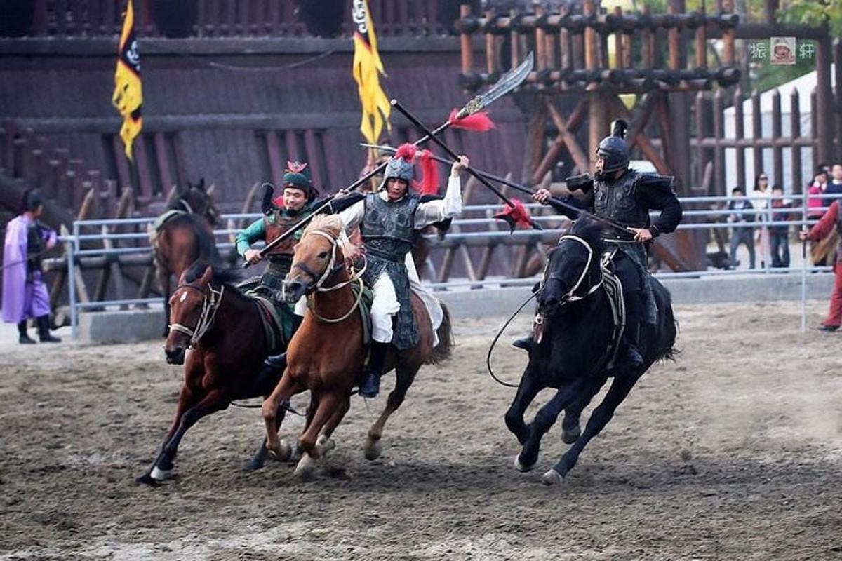 a group of people riding horses with flags