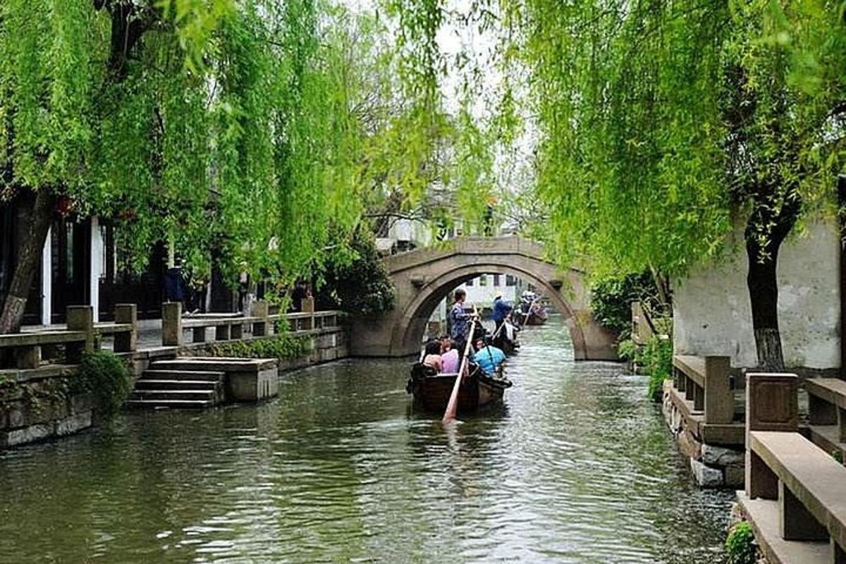 a group of people riding a boat down a river