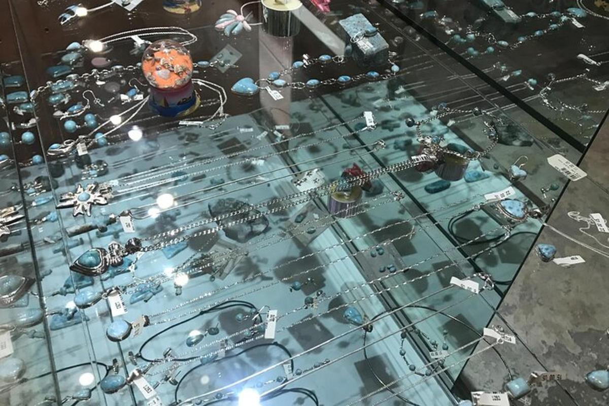 a glass table with many objects on top of it