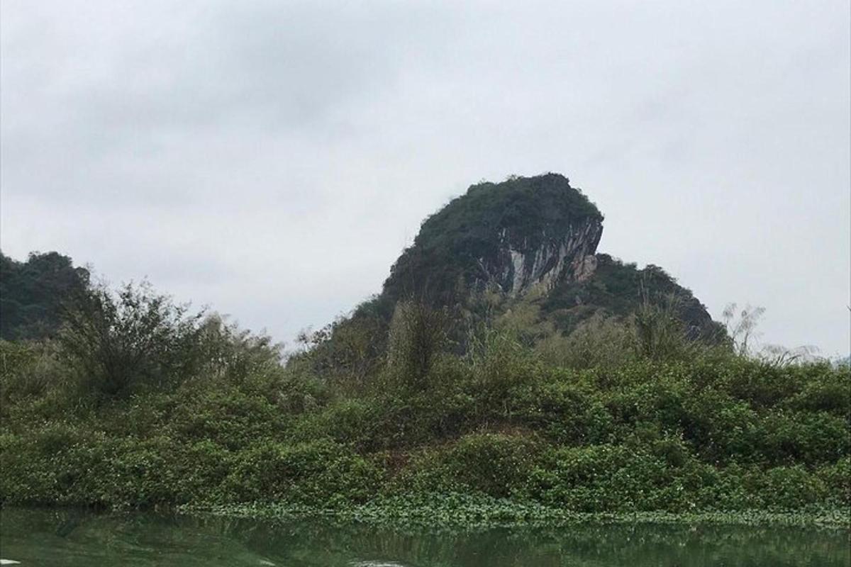 a mountain in the middle of a body of water