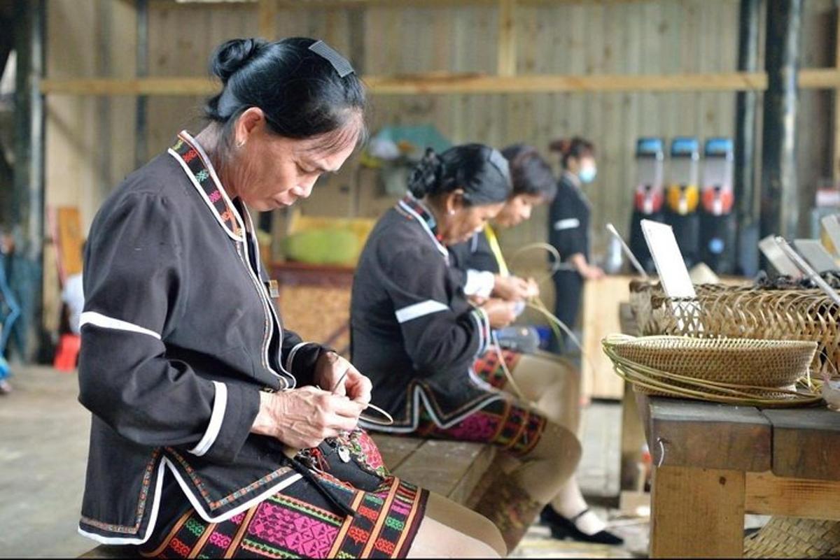 a group of women sitting down working on their computers