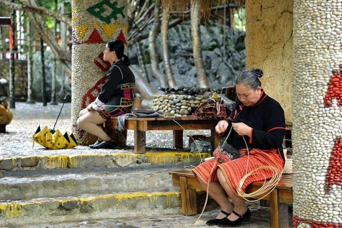 a woman sitting on a bench tied to a pole