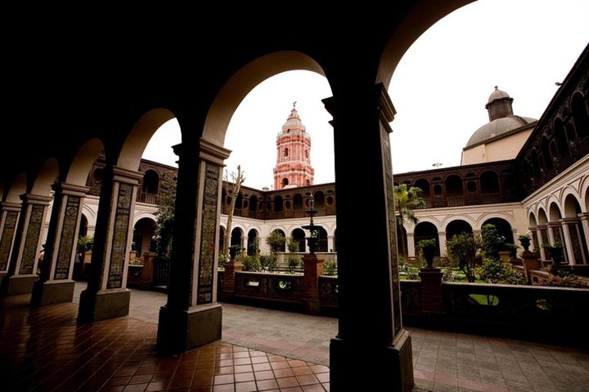 a view of a building with a clock tower in the background