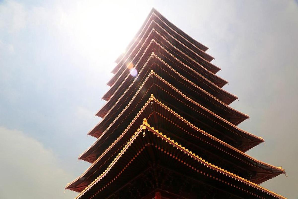 a tall building with lights on the top of it