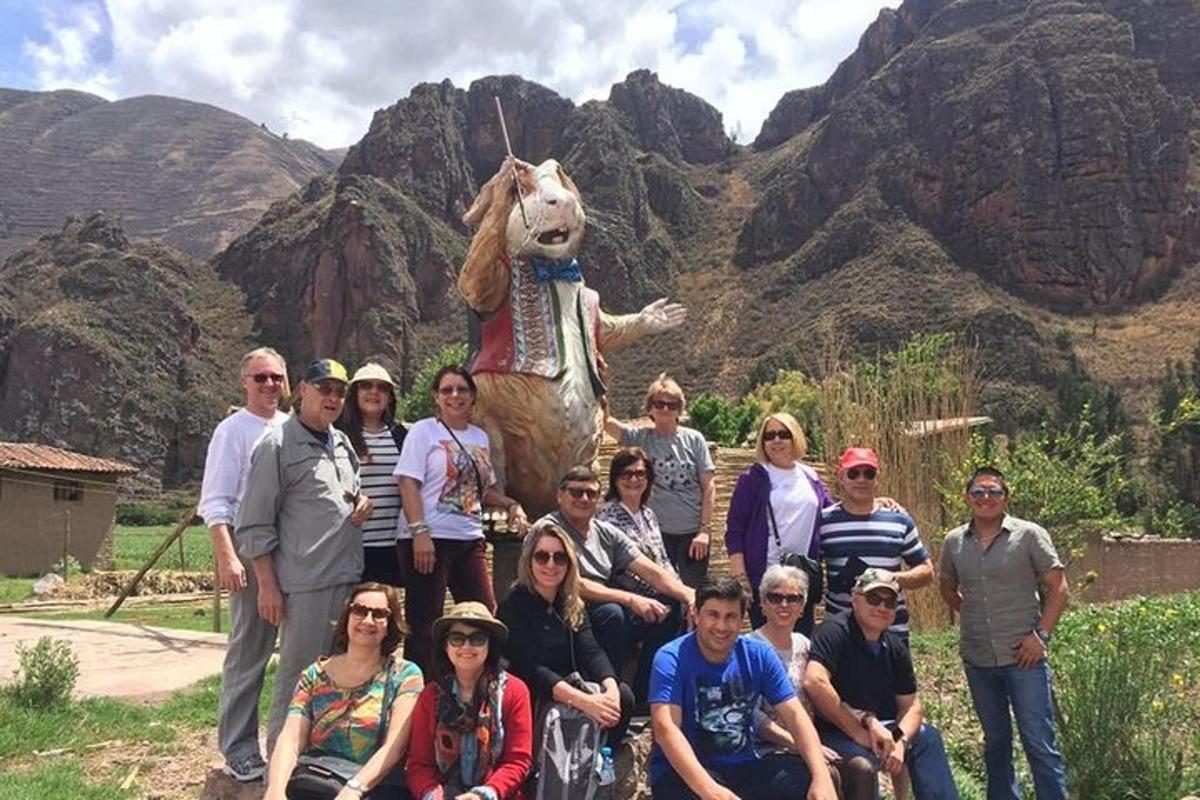 a group of people posing for a picture in front of a mountain