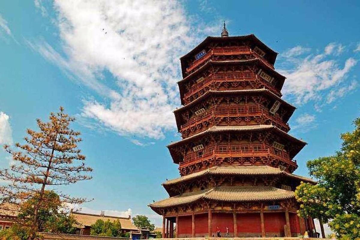 a tall tower with a sky in the background