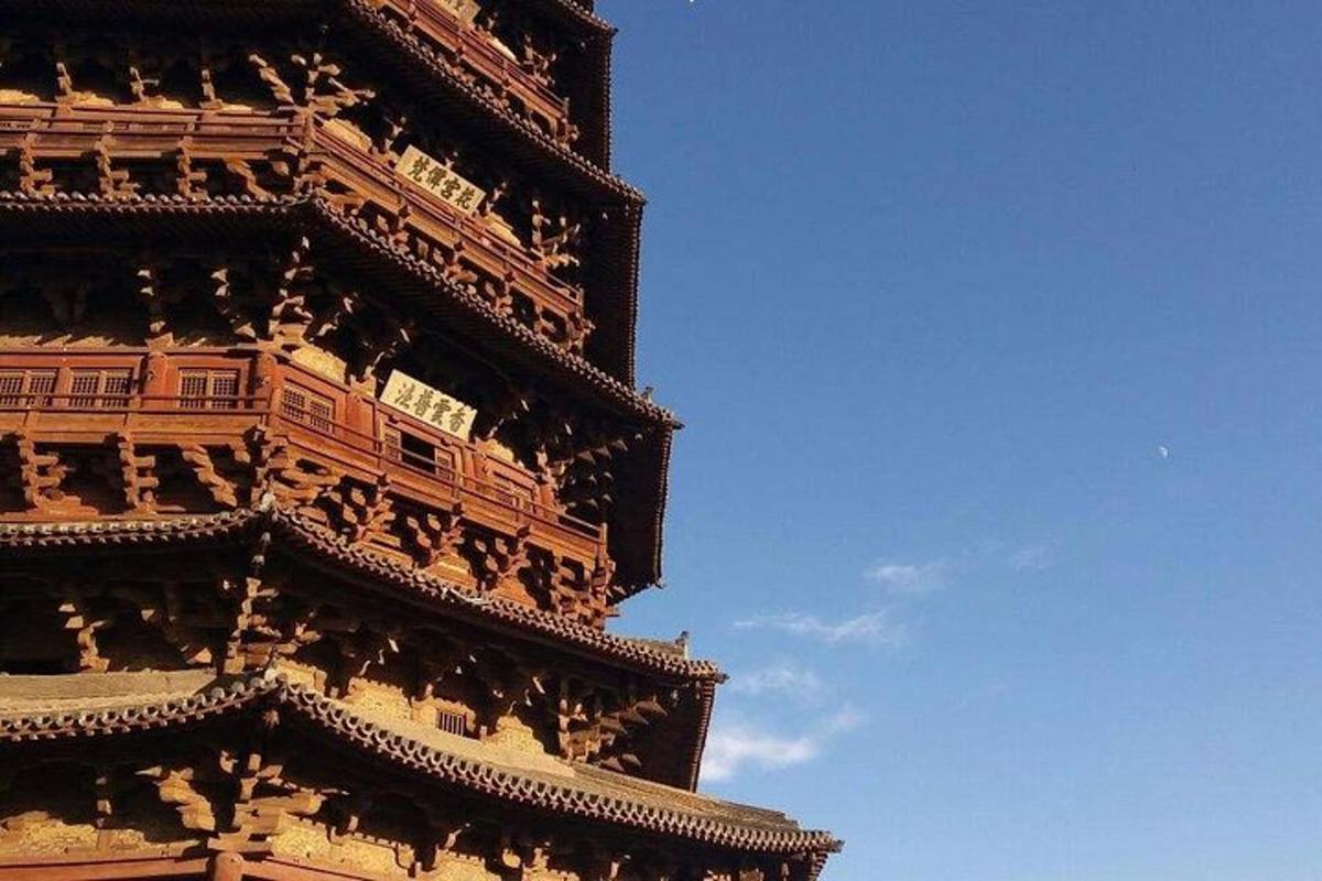 a tall building with a blue sky in the background