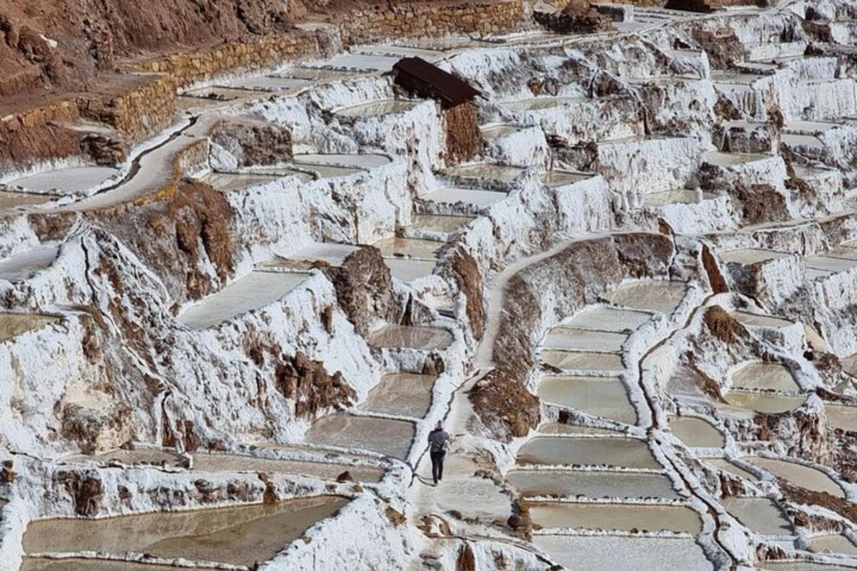 a person walking down a stone path on a mountain