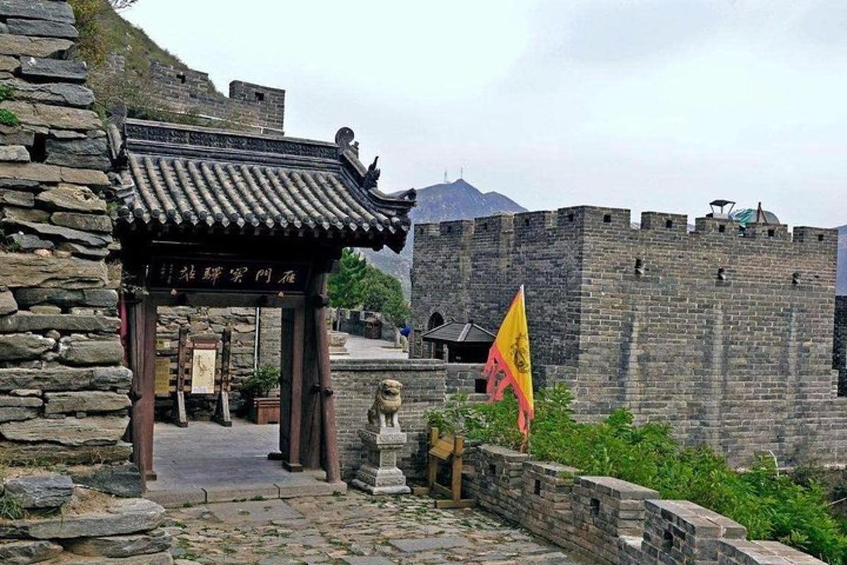 a building with a statue in front of a castle