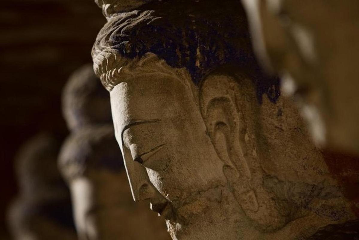 a statue of a face on the side of a statue