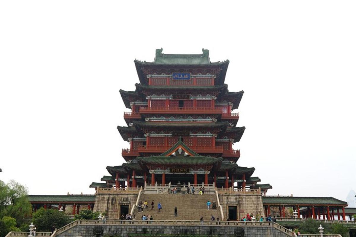 a large building with people standing in front of it