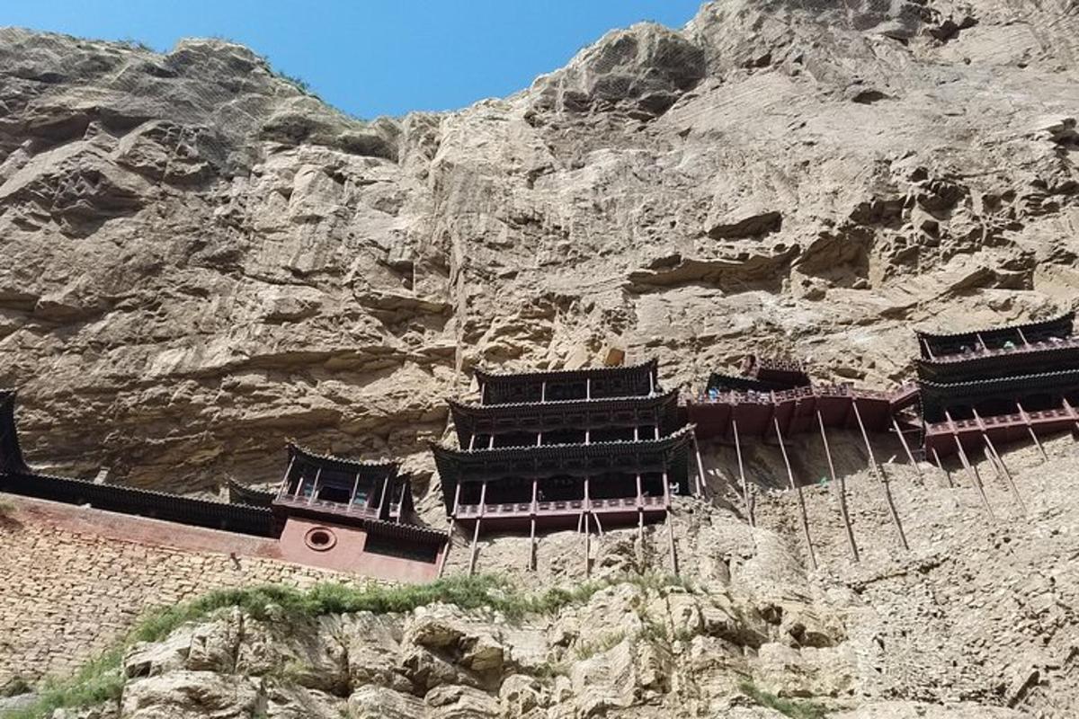 a building on the side of a mountain