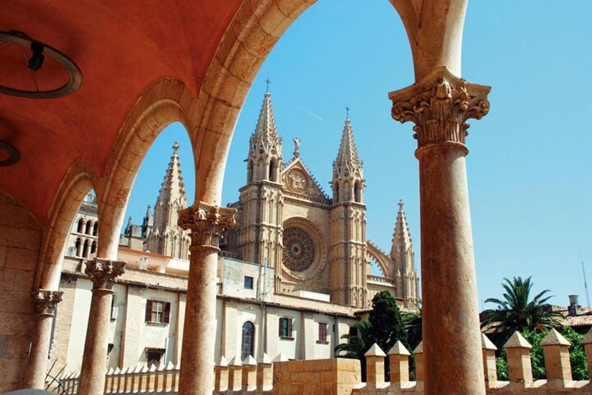 a building with an archway and a building with towers