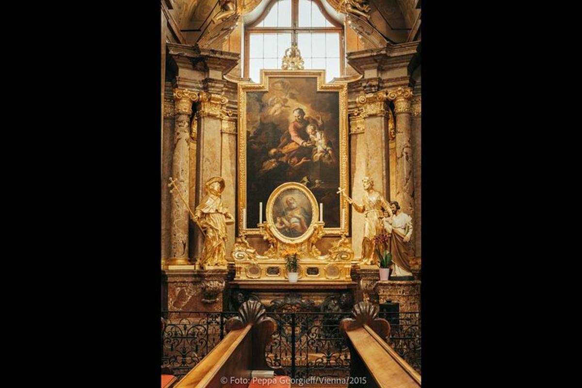 a church with a painting on the wall and a window