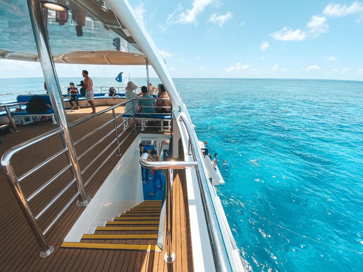 a group of people on a boat in the ocean