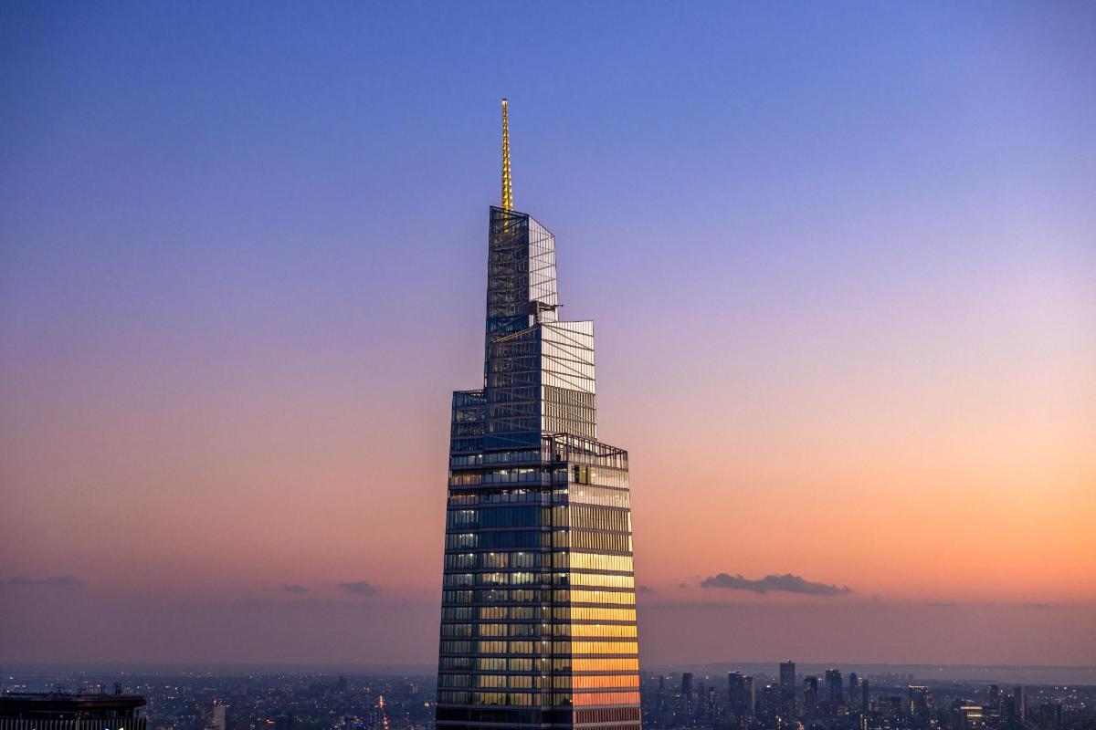 a tall skyscraper with a needle
