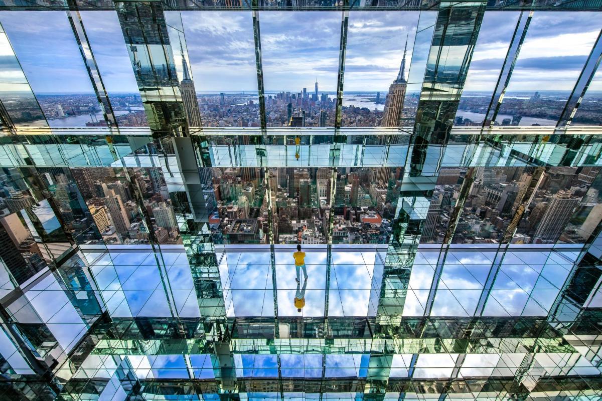 a view of the city from the top of a skyscraper
