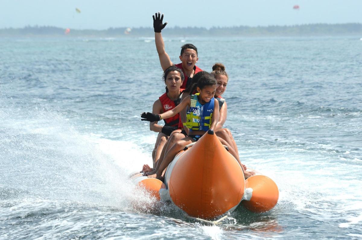 a group of people riding a jet ski in the water