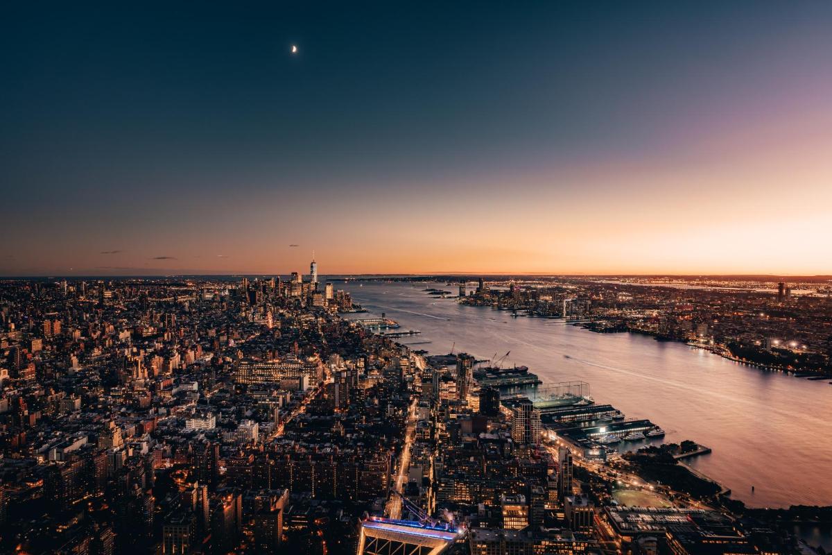 an aerial view of a city and the river