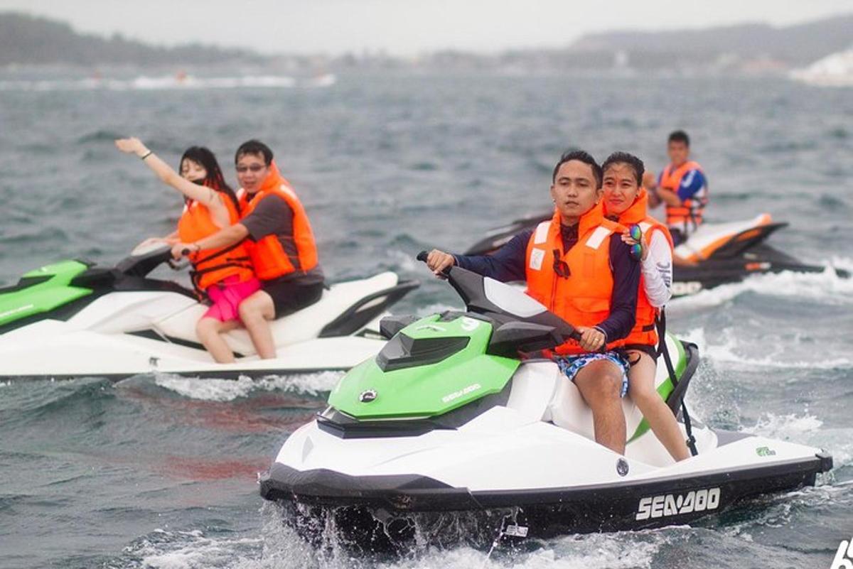 a group of people riding on a jet ski in the water