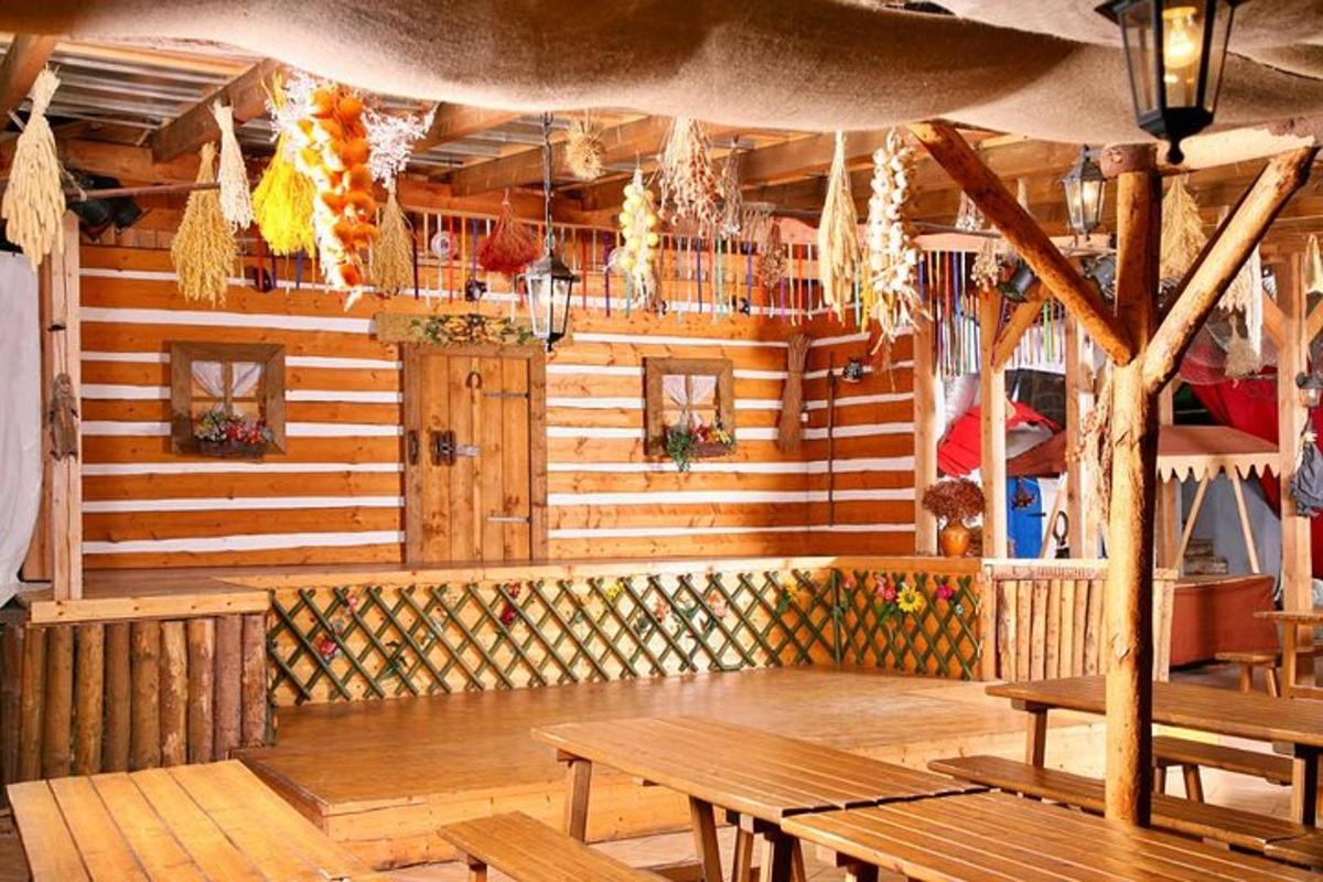 a restaurant with wooden walls and wooden tables and benches