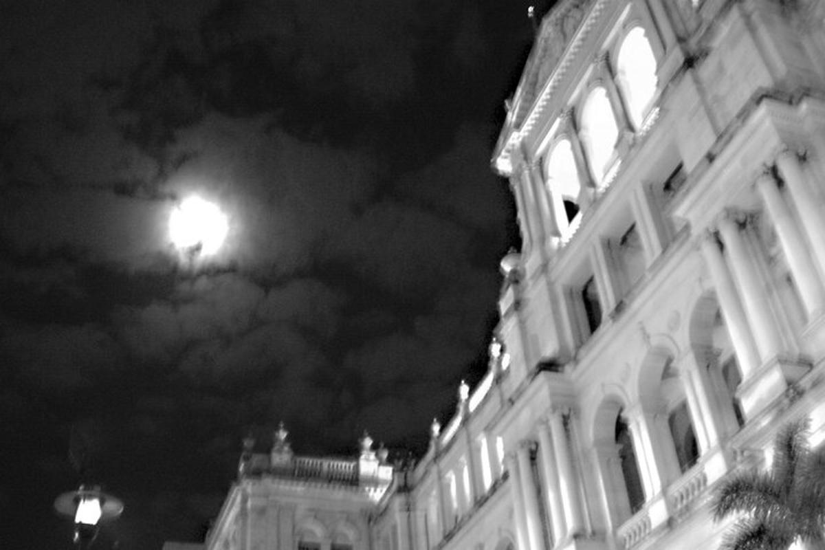 a black and white photo of a building at night