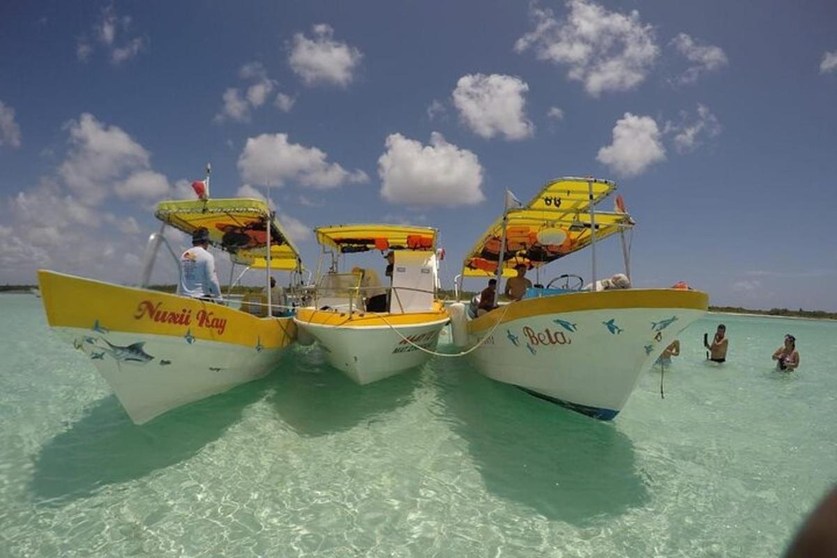 two boats sitting in the water in the ocean