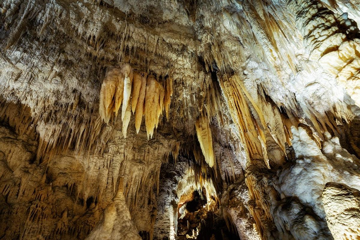 a cave with icicles hanging from the ceiling