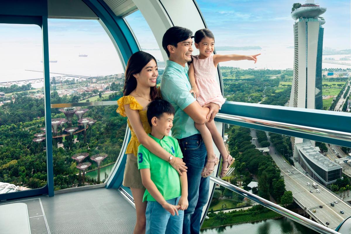 a family standing on the edge of a tower