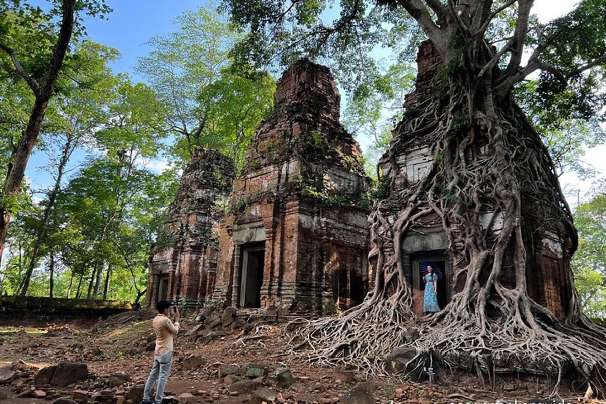 a man standing in front of a building with a tree