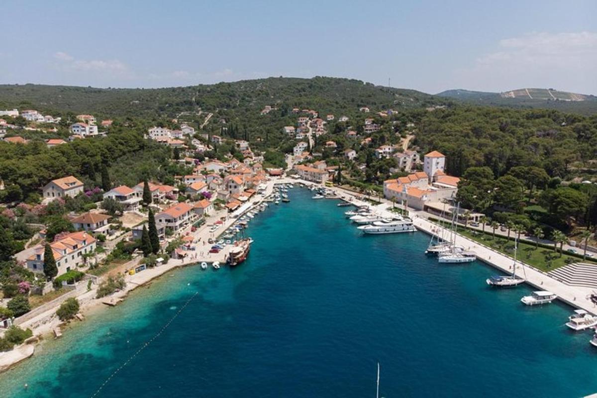 an aerial view of a harbor with boats in the water