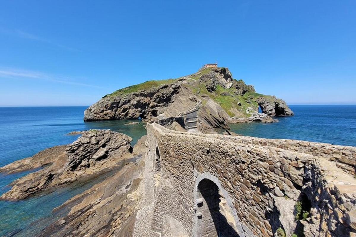 a bridge on a cliff near the ocean
