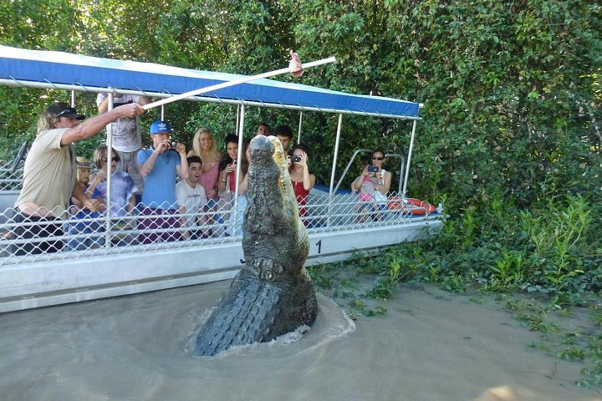 a statue of a bear in front of a group of people