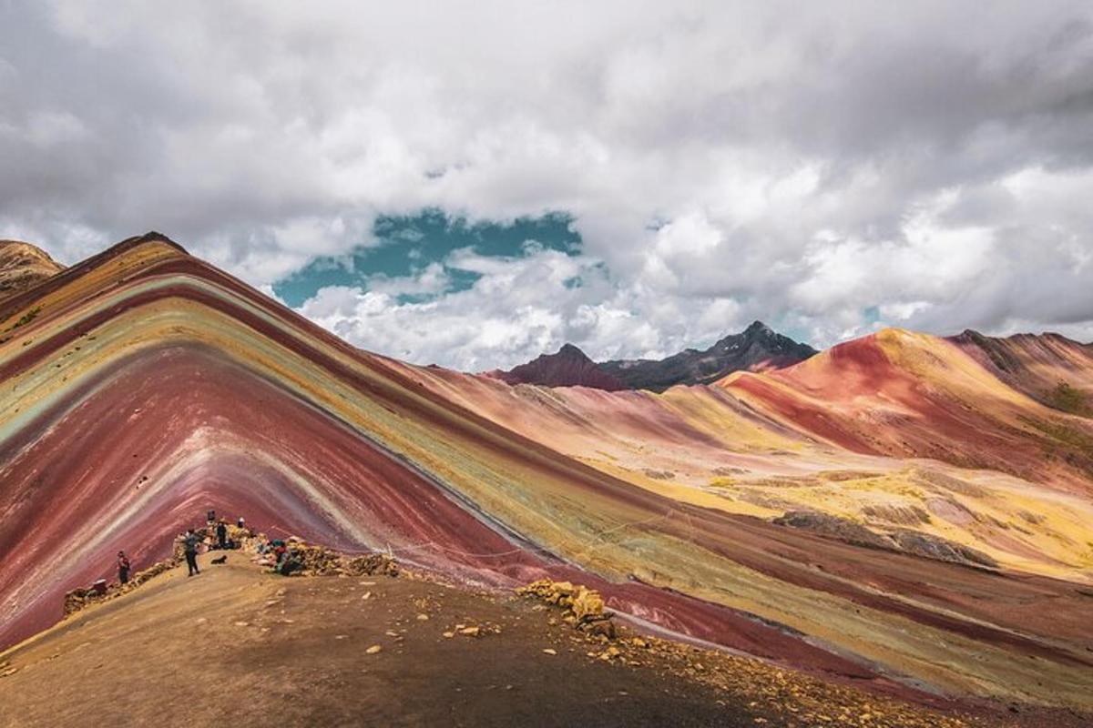 a group of people standing on top of a mountain