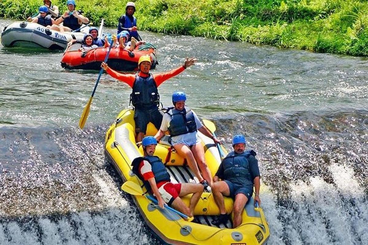 a group of people on a raft in a river