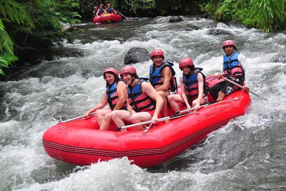 a group of people in a raft on a river